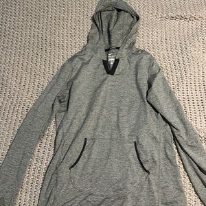 Nike Gray pullover with hood and pocket.